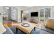 Inviting space featuring large windows, wood floors, and comfortable seating arrangement at 1110 Butternut Dr, Columbus, IN 47201