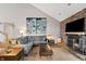 Spacious living room featuring a fireplace and a comfortable gray sectional sofa at 1110 Butternut Dr, Columbus, IN 47201