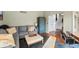 Comfortable living area with hardwood floors, blue armoire and a neutral sectional sofa at 1110 Butternut Dr, Columbus, IN 47201
