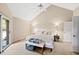 Bright primary bedroom suite with vaulted ceilings and a sliding door to the outdoors at 1110 Butternut Dr, Columbus, IN 47201