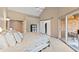 Spacious primary bedroom offers a walk-in closet and access to a private balcony at 1110 Butternut Dr, Columbus, IN 47201