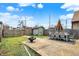 Secluded backyard with a patio featuring a dining table and a charming fire pit at 1111 Fletcher Ave, Indianapolis, IN 46203