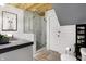 Bathroom features a modern shower, white shiplap walls, and a wood ceiling at 1111 Fletcher Ave, Indianapolis, IN 46203