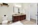 Bathroom with a double vanity, a toilet, and a tiled floor at 1111 Fletcher Ave, Indianapolis, IN 46203