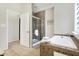 Bathroom with a soaker tub, a walk-in shower, and tiled floor at 1111 Fletcher Ave, Indianapolis, IN 46203