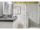 Bathroom with a grey countertop, white cabinets, modern shower and decor at 1111 Fletcher Ave, Indianapolis, IN 46203