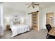 Comfortable bedroom with a stylish sliding barn door, inviting artwork, and ample lighting for a peaceful retreat at 1111 Fletcher Ave, Indianapolis, IN 46203