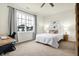 Bright bedroom featuring a large window with a view, and a cozy workspace, creating a serene atmosphere at 1111 Fletcher Ave, Indianapolis, IN 46203