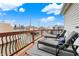 Relax on this inviting deck, furnished with comfortable lounge chairs and offering a cityscape backdrop under a blue sky at 1111 Fletcher Ave, Indianapolis, IN 46203