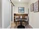 Cozy dining area with wood-paneled accent wall and sliding barn door at 1111 Fletcher Ave, Indianapolis, IN 46203