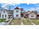 Charming two-story home with stone accents, a balcony, and well-manicured front yard at 1111 Fletcher Ave, Indianapolis, IN 46203