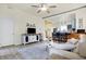 Bright, open living room and kitchen featuring hardwood floors, stylish decor, and a modern entertainment center at 1111 Fletcher Ave, Indianapolis, IN 46203