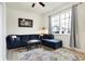 Comfortable living room features large sectional couch, area rug, and natural light at 1111 Fletcher Ave, Indianapolis, IN 46203