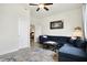 Cozy living room with large sectional, area rug, and open doorway at 1111 Fletcher Ave, Indianapolis, IN 46203