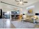 Bright, open living room and kitchen featuring hardwood floors, stylish decor, and a modern breakfast bar at 1111 Fletcher Ave, Indianapolis, IN 46203