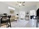 Bright living room with hardwood floors, neutral walls, and a modern console table near the entry at 1111 Fletcher Ave, Indianapolis, IN 46203