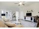 Bright living room featuring hardwood floors, modern décor, and a contemporary entertainment center at 1111 Fletcher Ave, Indianapolis, IN 46203