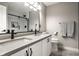 Modern bathroom featuring double sinks, a large mirror, and sleek fixtures for a spa-like experience at 11686 Belle Plaine Blvd, Fishers, IN 46037