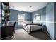 Cozy bedroom with natural light, carpet floors, and a desk, offering a comfortable and private space at 11686 Belle Plaine Blvd, Fishers, IN 46037