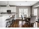 Cozy dining area featuring neutral tones, hardwood floors and is located next to the kitchen perfect for entertaining at 11686 Belle Plaine Blvd, Fishers, IN 46037