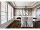 Traditional dining room featuring a dark wood table set, soft chairs, and bright windows at 11686 Belle Plaine Blvd, Fishers, IN 46037
