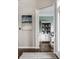 Home entryway with a white pillar separating spaces and an open view of the home office at 11686 Belle Plaine Blvd, Fishers, IN 46037