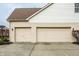 Attached two-car garage with neutral-colored doors and a paved driveway, providing ample parking space at 11686 Belle Plaine Blvd, Fishers, IN 46037