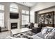 Elegant living room with fireplace, large windows, and stylish furniture at 11686 Belle Plaine Blvd, Fishers, IN 46037
