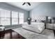 Comfortable main bedroom featuring a cozy bed, large windows, and soft colors at 11686 Belle Plaine Blvd, Fishers, IN 46037