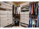 Spacious walk-in closet features custom shelving, drawers, and hanging space for optimal organization at 11686 Belle Plaine Blvd, Fishers, IN 46037