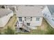 Aerial view of the house showcasing a deck, patio, and spacious backyard, perfect for outdoor living at 12610 Broadmoor N Ct, Fishers, IN 46037