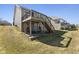 View of the backyard featuring a covered patio and deck, ideal for outdoor living and entertaining at 12610 Broadmoor N Ct, Fishers, IN 46037