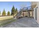 Backyard view featuring a spacious patio area and deck stairs, perfect for outdoor enjoyment at 12610 Broadmoor N Ct, Fishers, IN 46037