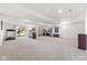 Finished basement area with neutral carpet and a sliding door for convenient outside access at 12610 Broadmoor N Ct, Fishers, IN 46037