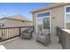 This deck features a sliding glass door and seating, offering a relaxing outdoor space at 12610 Broadmoor N Ct, Fishers, IN 46037