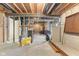 Unfinished basement with exposed wood ceiling and visible plumbing, providing potential for customization at 12610 Broadmoor N Ct, Fishers, IN 46037