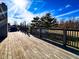 Wooden deck with weathered boards and fenced railing, providing a backyard view at 12930 River Grove Dr, Columbus, IN 47203