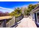 Back deck overlooking a large yard with trees and a playground at 12930 River Grove Dr, Columbus, IN 47203