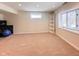 Large, carpeted basement area with lots of natural light at 12930 River Grove Dr, Columbus, IN 47203