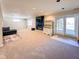 Bright basement area with a fireplace, a sliding door and neutral walls at 12930 River Grove Dr, Columbus, IN 47203