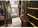 Basement equipment including an air filter, shelving, and humidifier at 12930 River Grove Dr, Columbus, IN 47203