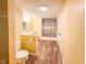 Well-lit bathroom featuring a shower with a curtain, a mirror, and a vanity with a sink at 12930 River Grove Dr, Columbus, IN 47203