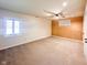 Bright bedroom featuring a ceiling fan, neutral carpeting, and a unique accent wall at 12930 River Grove Dr, Columbus, IN 47203
