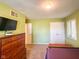 Comfortable bedroom with a dresser, and a well-lit ceiling fixture at 12930 River Grove Dr, Columbus, IN 47203