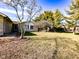 Well maintained front yard with mature trees at 12930 River Grove Dr, Columbus, IN 47203