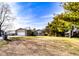 Charming single-story home with a well-manicured lawn and mature trees in a tranquil neighborhood setting at 12930 River Grove Dr, Columbus, IN 47203