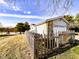 Detached two car garage with mature trees and a fenced yard at 12930 River Grove Dr, Columbus, IN 47203