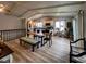 Open floor plan view of a kitchen with wood floors, dining area, and lots of natural light at 12930 River Grove Dr, Columbus, IN 47203