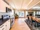 Modern kitchen with stainless steel appliances that opens to the dining and living area at 12930 River Grove Dr, Columbus, IN 47203