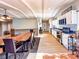 Bright kitchen and dining area featuring wood floors, exposed beams, and stainless steel appliances at 12930 River Grove Dr, Columbus, IN 47203